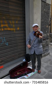 Italy - March, 17, 2011:Old Man Playing  Violin At The  Florence,Italy.