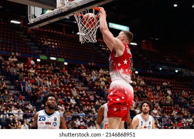 Italy, Milan, apr 16 2022: Kaleb Tarczewski (Armani center) dunk shot in the 1st quarter during basketball game A|X ARMANI MILAN vs GEVI NAPOLI, LBA 2021-2022 day27 Mediolanum Forum