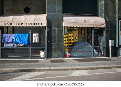 Italy, Milan, April 2020, Quarantine In Milan, Downtown In COVID19 Period, The Bar Tables Are No Longer There And The Space Becomes Shelter For The Homeless.