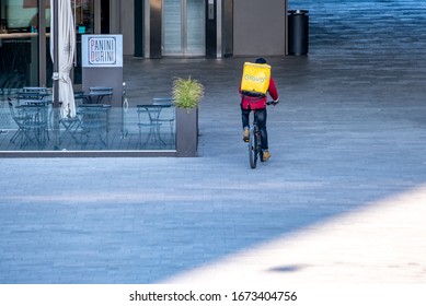 Italy, Milan, March 2020, Runners Bring Groceries Home During The Quarantine Period In The Citylife District In Milan. Quarantine Caused By COVID19, Coronavirus.