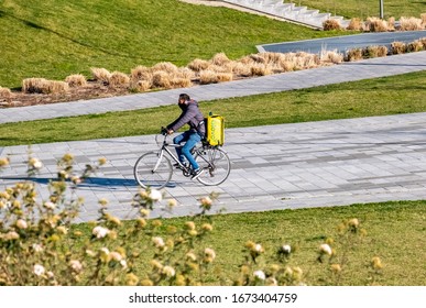 Italy, Milan, March 2020, Runners Bring Groceries Home During The Quarantine Period In The Citylife District In Milan. Quarantine Caused By COVID19, Coronavirus.