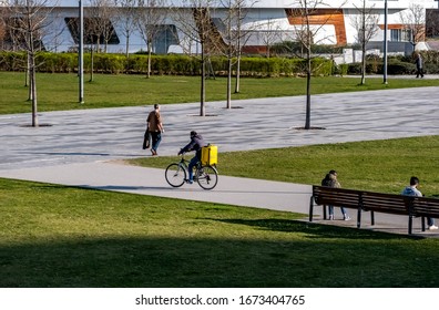 Italy, Milan, March 2020, Runners Bring Groceries Home During The Quarantine Period In The Citylife District In Milan. Quarantine Caused By COVID19, Coronavirus.