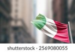 Italy national flag waving on street. A beautiful with mast with blur buildings. Italy national flag for independence day.