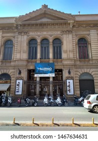 Italy, Palermo -October 8, 2018: Facade Of Tetra Biondo, With A Poster And A Repertoire Of Performances, An Authentic Sicilian Street With Motorcycles And Bikes On A Sunny Day