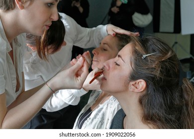 Italy, Sicily, Palermo; 8 April 2013, make-up artists putting make-up on women - EDITORIAL
