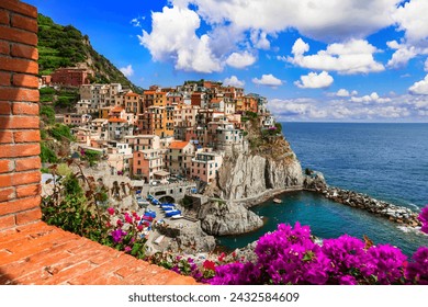 Italy travel and landmarks. . Colorful fishing village Manarola- National Park "Cinque terre" in Liguria, popular tourist destination. - Powered by Shutterstock