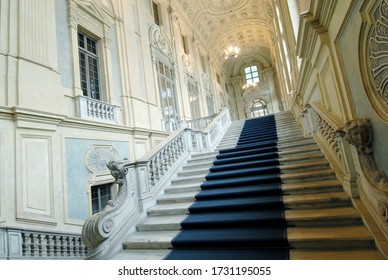 Italy / Turin – May 16, 2018: Palazzo Madama Is The Work Of The Architect Filippo Juvarra. The Interior Is Divided Into An Immense Atrium Where The Majestic Double Ramps Of The Grand Staircase Wind.