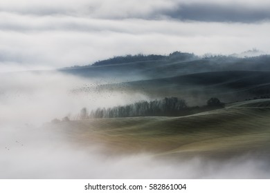 Italy. Tuscany. Fog on the valley fields Val d'Orcia