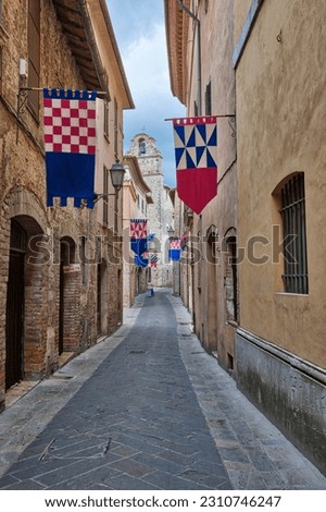 Italy, umbria. streets in the historic district of san gemini decked out with festival jousting flags.