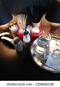 Items for coffee on a table in a cafe
