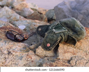 Items Lost In The Wake Of Navy SEAL Trainees Running On The Beach During Hell Week. Two Very Different People Lost Some Important Items Of Theirs.