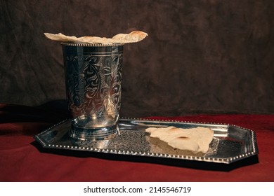 Items For The Rite Of The Easter Church Communion A Bowl Of Wine On A Platter With Breads Of Remembrance On A Crimson Fabric