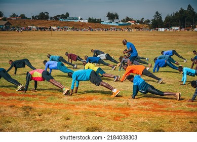 ITEN, KENYA, 22 JANUARY, 2022: Warm-up Of Kenyan Runners Before Athletic Running Training. Preparation For The Marathon And The World Championships In Athletics