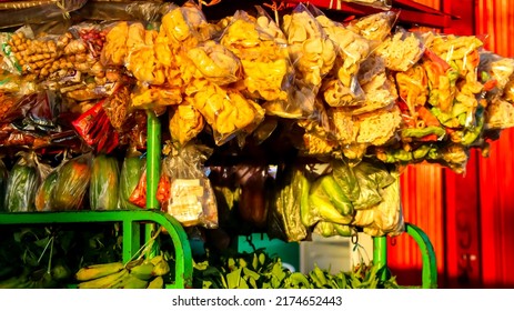 Itinerant vegetable sellers add crackers to sell them - Shutterstock ID 2174652443
