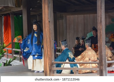 Itsukushima, Japan-April 2019; Stage View With Traditional Performance Of Japanese Noh Theatre Part Of The Itsukushima Shrine, Nogaku No Theatre Also Called Miyajima