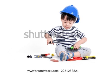 ittle boy playing act engineer, education concept.