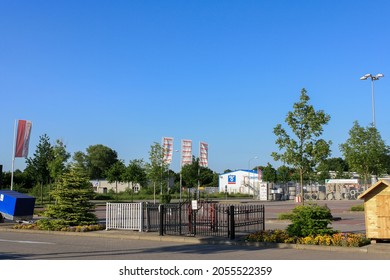 Itzehoe, Germany - Jun 2010: View Of Hagebaumarkt Outdoor Store In Summer With Sunny Blue Sky Background. Product Retail Of Hardware, Building Materials, Wood, Tiles And Garden. No People.