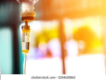 Iv Bag Fluid Intravenous Drop Saline Drip Slow Hospital Room,medical Concept,treatment Emergency Shock And Injection Drug Infusion Care Chemotherapy,concept.blue Light Background,selective Focus