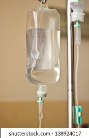 IV Bag Hanging On A Metal Pole In The Room