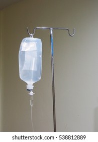 IV Bag Hanging On A Metal Pole In The Room,Soft Focus And Vintage Style.