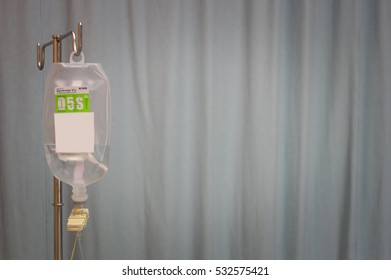 IV Bag, Saline Bag Hanging On A Metal Pole In Patient Rooms.