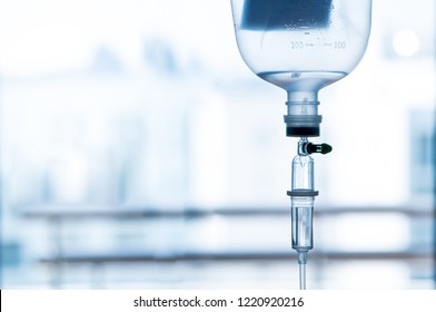 The IV drip chamber, tubing, and bag of solution. - Powered by Shutterstock