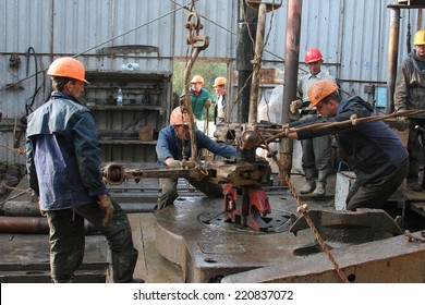 Ivano Frankivsk region, UKRAINE - 2 September 2008: Drilling oil derrick. Drilling oil derrick. People fix drill for drilling rocks