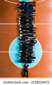 Ivano-Frankivsk, Ukraine May 15, 2021: Photo Of Students Lying On The Floor In The Gym, Top View, Students In Black Clothes, Drone Photo.