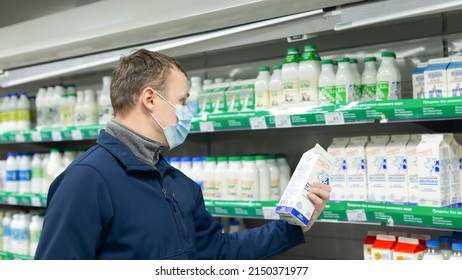 Ivanovo, Russia, February 20, 2022. Editorial. Food And Drinks. A Man In A Protective Face Mask Chooses Food In The Store.