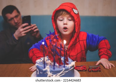 Ivanovo Russia- January 26, 2022: Blonde Five Years Old Boy In Spider Man Costume Blows Out The Candle On His Birthday Cake. 