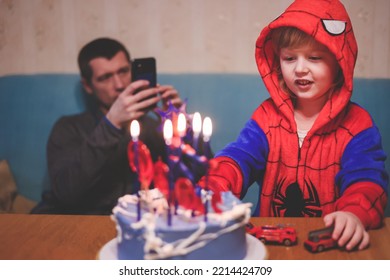 Ivanovo Russia- January 26, 2022: Blonde Five Years Old Boy In Spider Man Costume Blows Out The Candle On His Birthday Cake. 