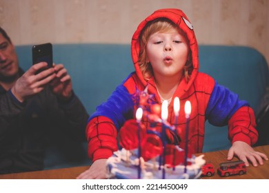 Ivanovo Russia- January 26, 2022: Blonde Five Years Old Boy In Spider Man Costume Blows Out The Candle On His Birthday Cake. 