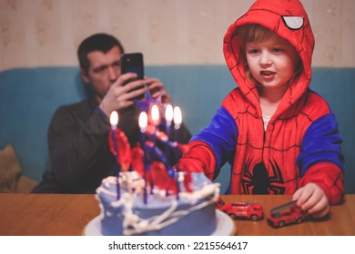 Ivanovo Russia- January 26, 2022: Soft Focus Blonde Five Years Old Boy In Spider Man Costume Blows Out The Candle On His Birthday Cake. 