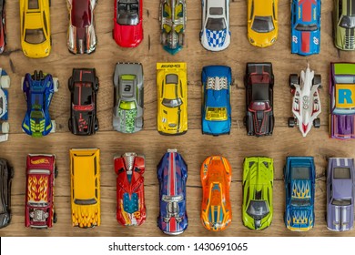 
Ivanovo, Russia - June, 2019 : The Group Of Colorful Toy Car Collection On Wooden Background. Hot Wheels. Top View. Selective Focus.