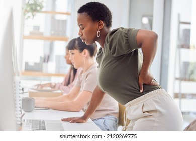 Ive Been Spending Hours On This Project. Shot Of A Businesswoman Experiencing Back Pain While Getting Up From Her Desk.