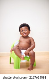 Ive Got This Potty Training Thing Down. Shot Of An Adorable Baby Boy Sitting On A Potty Training Seat.