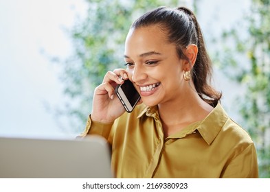 Ive Just Sent You An Email.... Cropped Shot Of An Attractive Young Woman Businesswoman Making A Phonecall While Working On Her Laptop At Home.