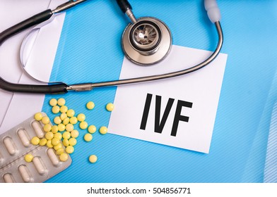 IVF Word Written On Medical Blue Folder With Patient Files, Pills And Stethoscope On Background