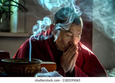 IVOLGINSKY DATSAN, ULAN UDE, SIBERIA, RUSSIA - MARCH 24, 2018: Buryat buddhist monk are praying at the Dzogchen Dugan in Ivolginsky datsan 