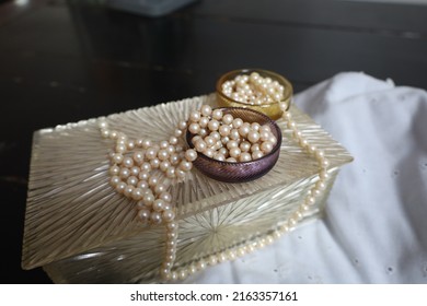 Ivory Colored Pears On An Antique Jewelry Box