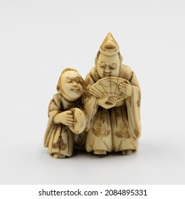 Ivory Netsuke.  A miniature carving or ornamental toggle used to attach a medicine box, pipe, or tobacco pouch to the obi (sash) of a Japanese man's traditional dress.