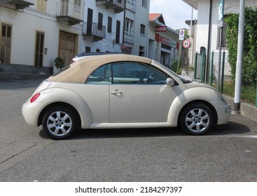 IVREA, ITALY - CIRCA JULY 2022: Off-white Cabrio Volkswagen New Beetle Car