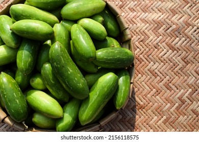 Ivy gourd or scarlet gourds known as Tindora or Ghola, green vegetables from tropical climate Indian Asian vegetables top view. Vegetables in basket