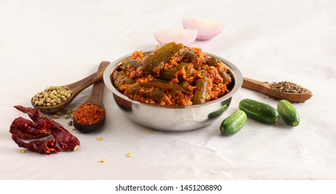 Ivy gourd or tindora curry, an Indian, vegetarian, and healthy side dish, for items like chapati and roti, and its main ingredients.