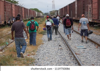 Ixtepec, Oaxaca/Mexico-2012. Central American migrants and asylum-seekers prepare to board the freight train they call La Bestia.