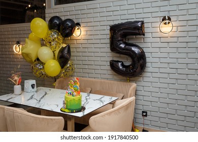 Izmail, Ukraine. November 2020. Birthday cake with Teenage Mutant Ninja Turtles, balloons for 5 years old boy theme birthday party.