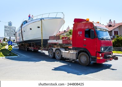 IZMIR - JULY 03 : Truck Carrying A Heavy Load (yacht) On Busy Highway , July 03 2013 In Izmir Turkey