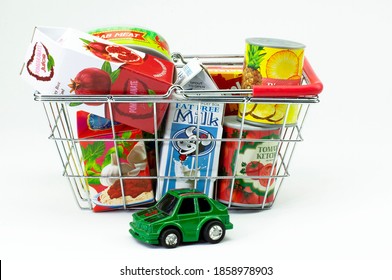 Izmir, Turkey, 11-22-2020, Food Items With Generic Labels In Shopping Basket On White Background