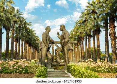 Izmir, Turkey - 26 May 2019: Two Black Men Statue Standing And Talking To Each Other In Public Park Called Kültürpark At Izmir, Turkey.