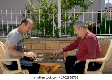 Izmir, Turkey, April 13 2020, Men Play Backgammon In The Garden